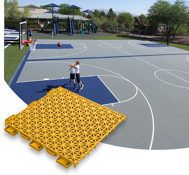 Versacourt Game Outdoor Tile - sample tile in foreground, example application at outdoor basketball court in background