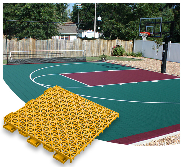 Versacourt Game Outdoor Tile - sample tile in foreground, example application at outdoor basketball court in background